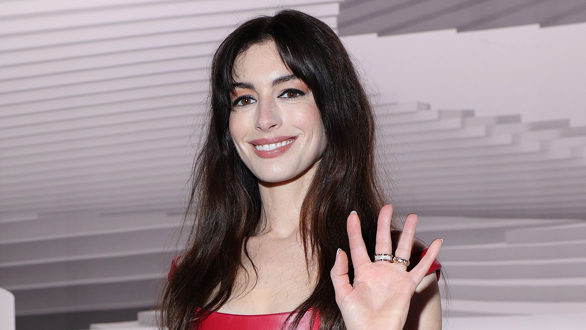 Anne Hathaway's jaw-dropping red leather dress is a fashion triumph for SS25
