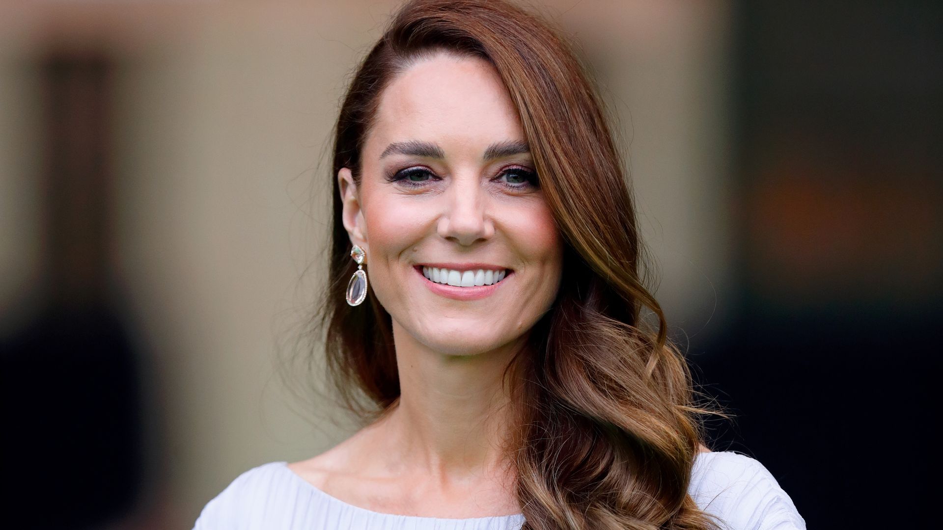 Duchess Kate looks pretty in pink at one of her final engagements before birth