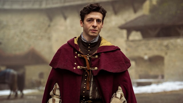 man wearing red cloak