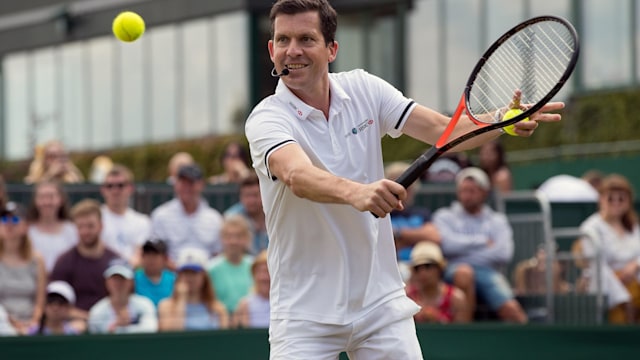 Tim Henman playing tennis