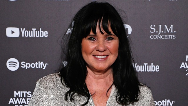 Coleen Nolan in sparkly silver shirt