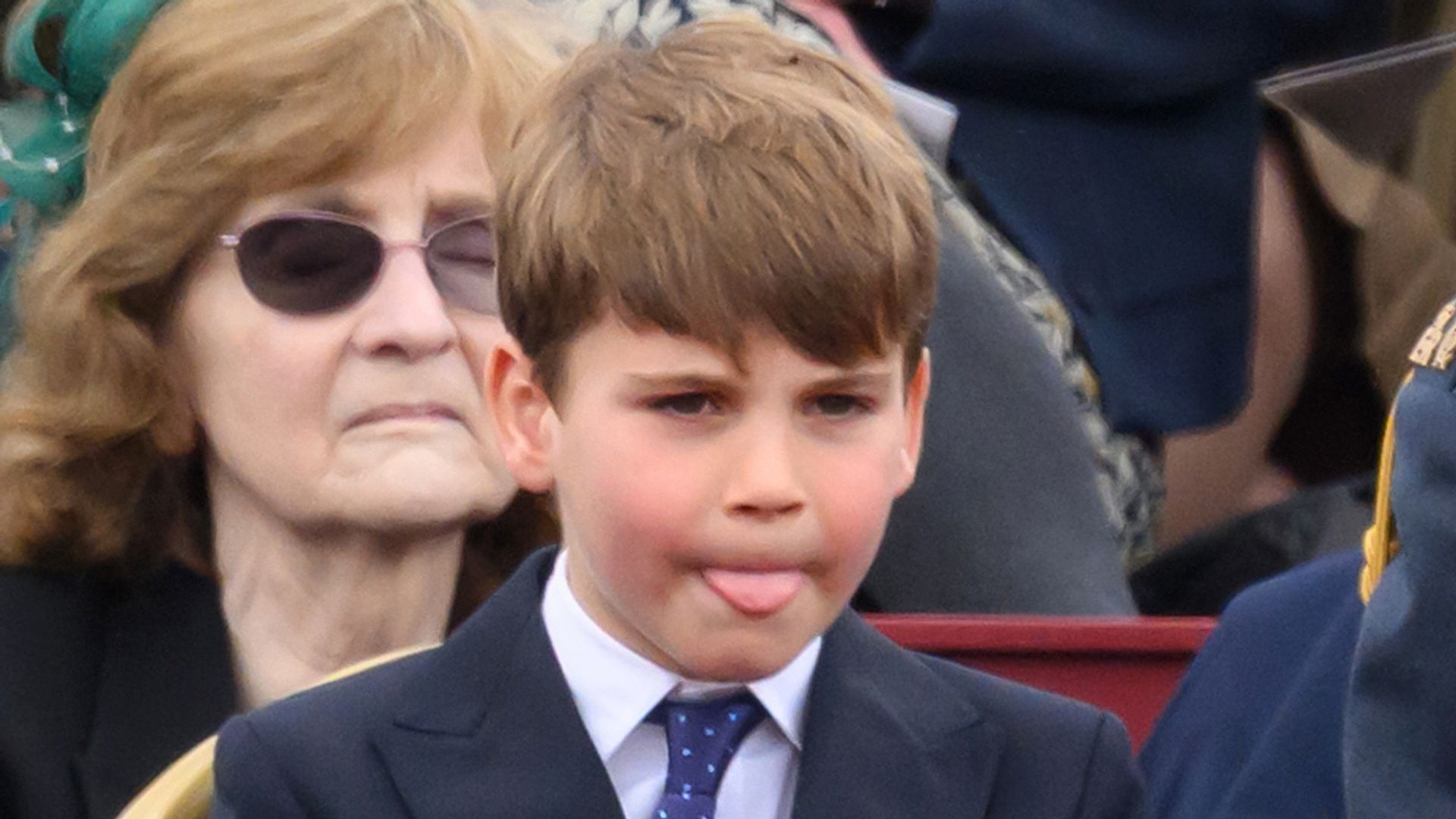 Prince Louis of Wales is being cheeky during the military procession to mark the 80th anniversary of VE Day on May 05, 2025 in London, England.
