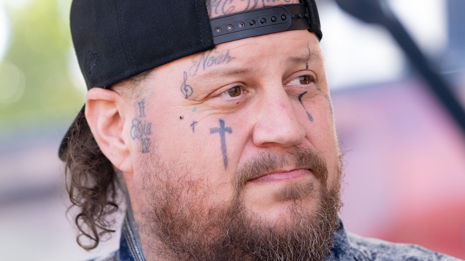 photo of jelly roll wearing backward baseball cap