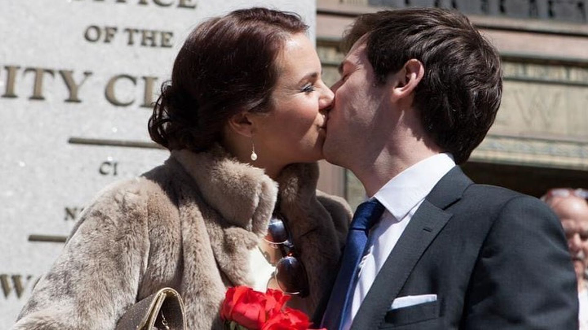 Nina Warhurst in a fur coat kissing her new husband Ted