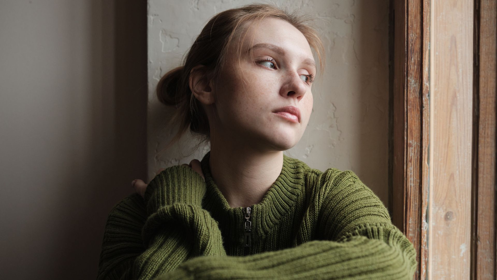 sad young woman in emotional pain.