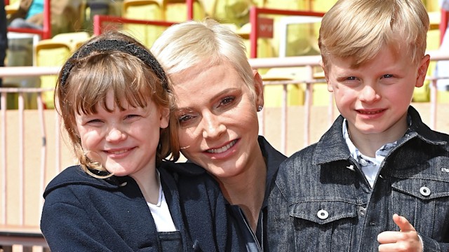 Princess Charlene of Monaco hugging her kids Princess Gabriella and Prince Jacques