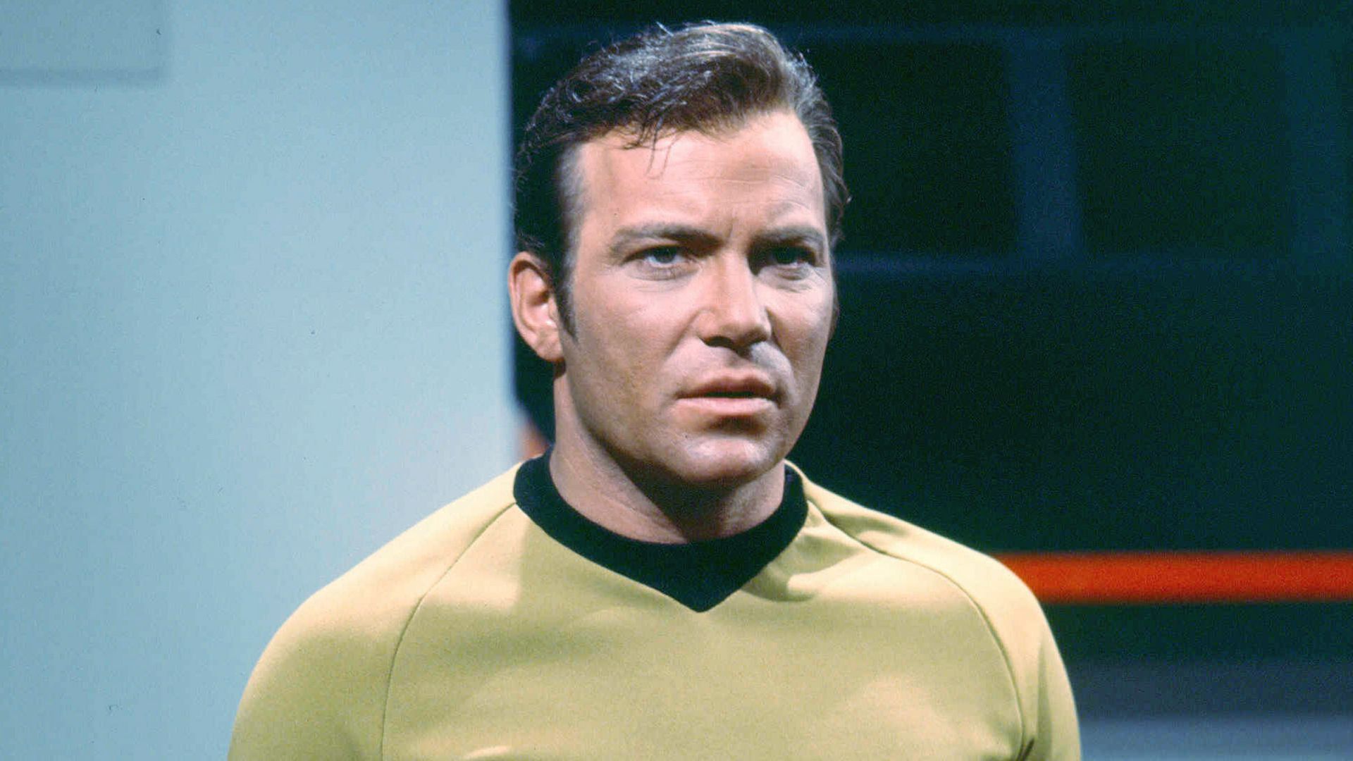 William Shatner as Captain James T. Kirk of the Starship Enterprise