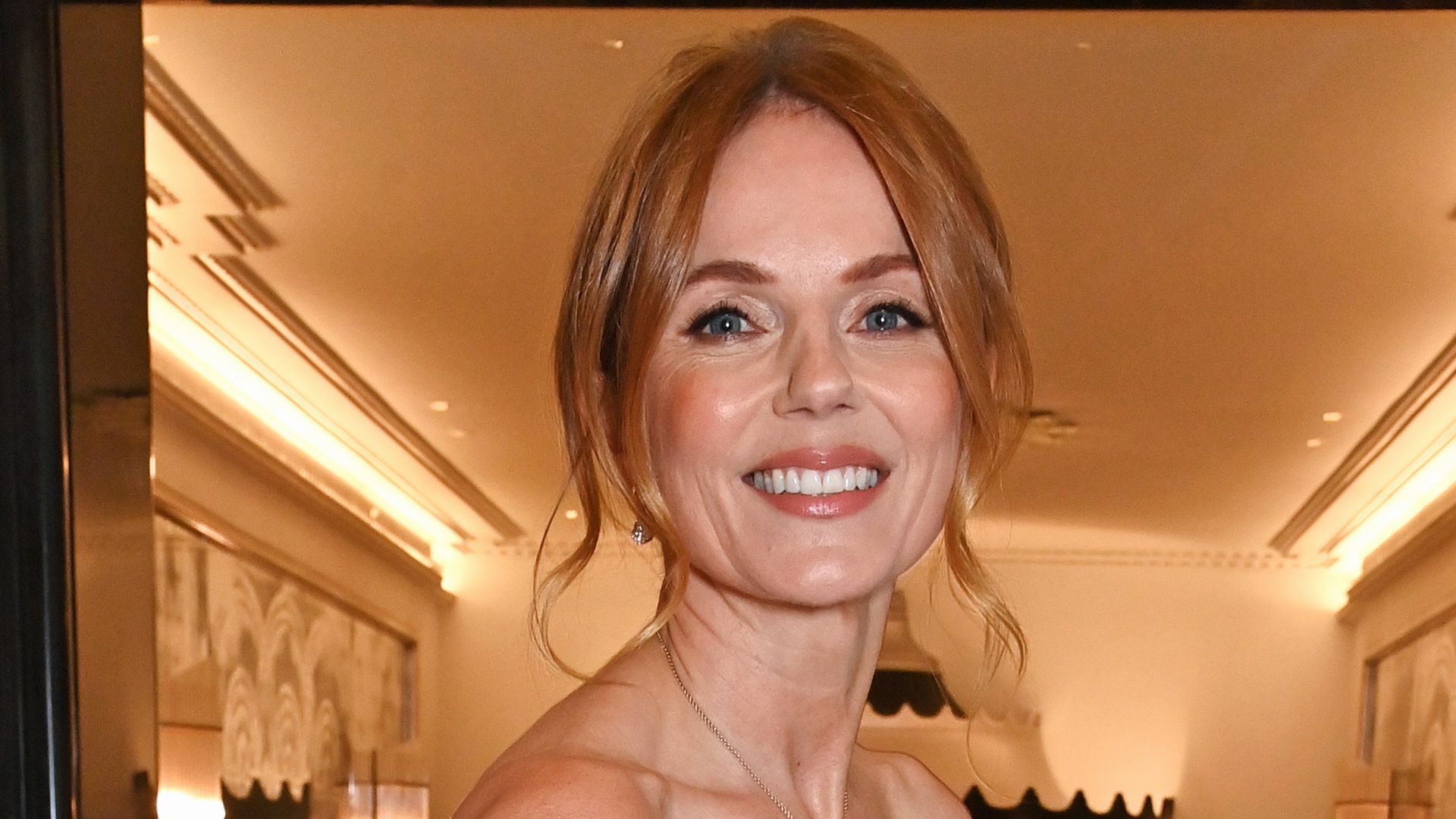Geri Halliwell-Horner with hand on her hip in floral gown