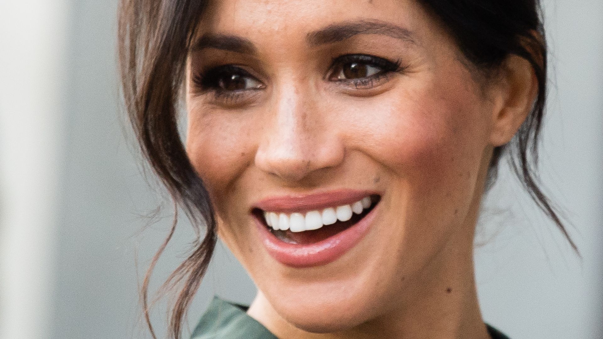 Meghan Markle smiling widely