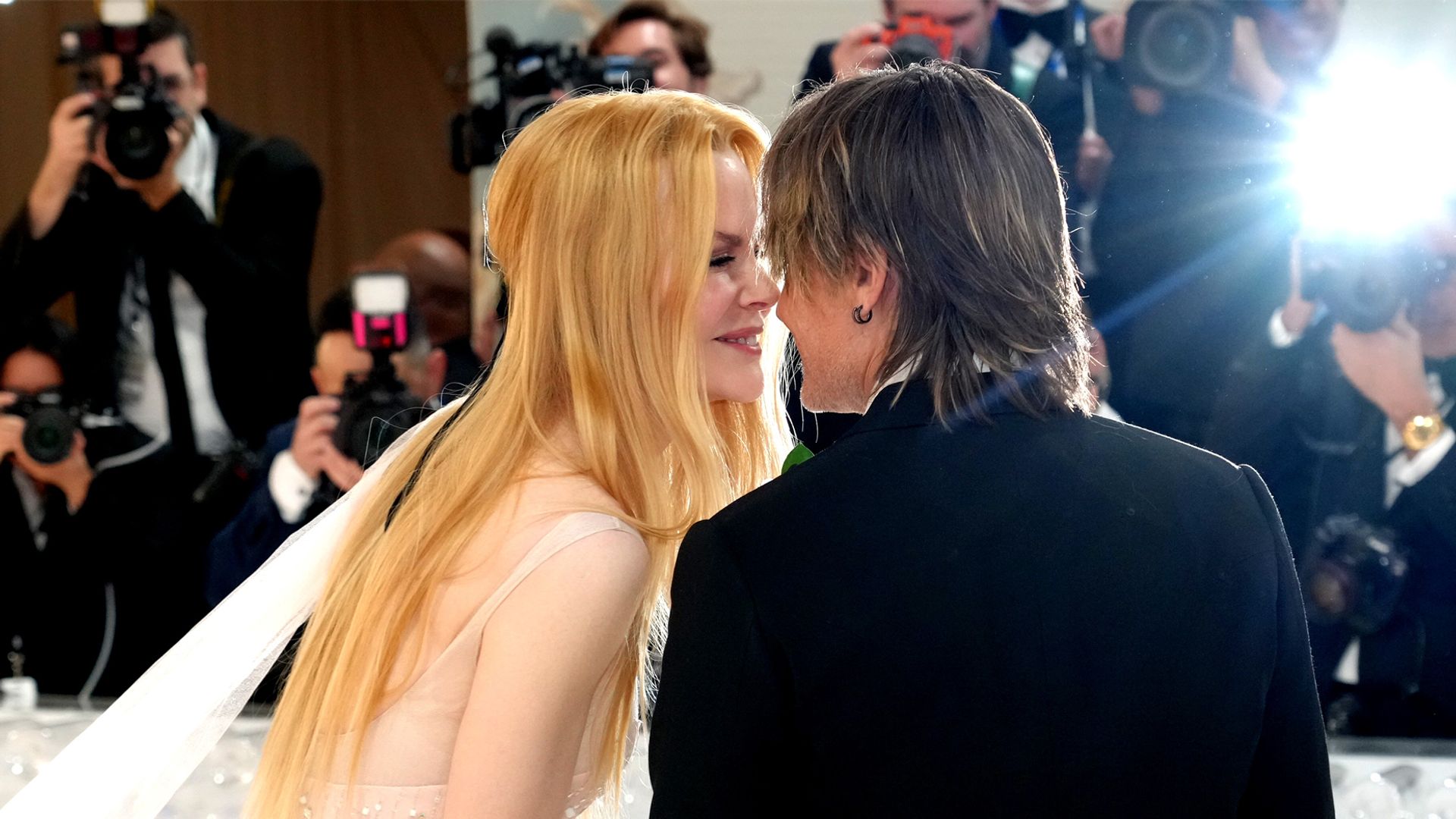 Nicole Kidman and Keith Urban look lovingly into each other's eyes at the Met Gala 2023