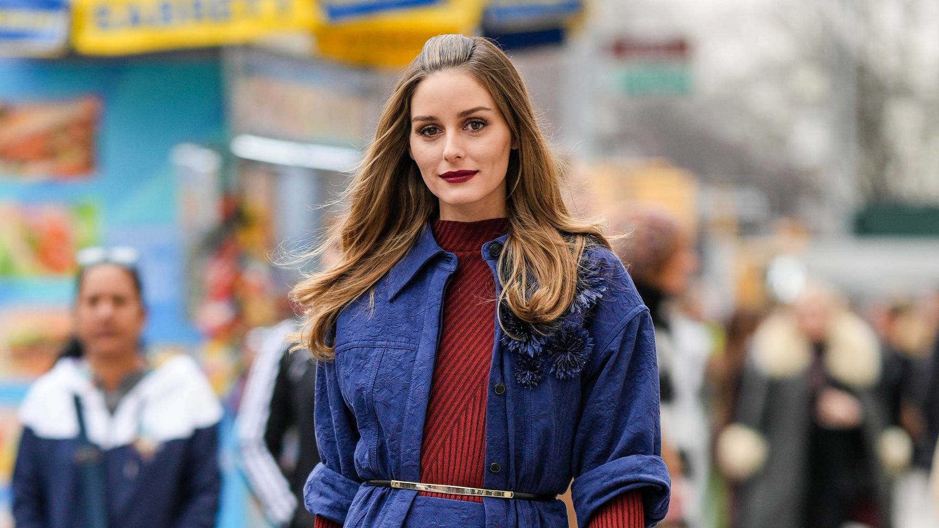 Olivia Palermo wearing a blue co-ord with a slim belt layered over the top 
