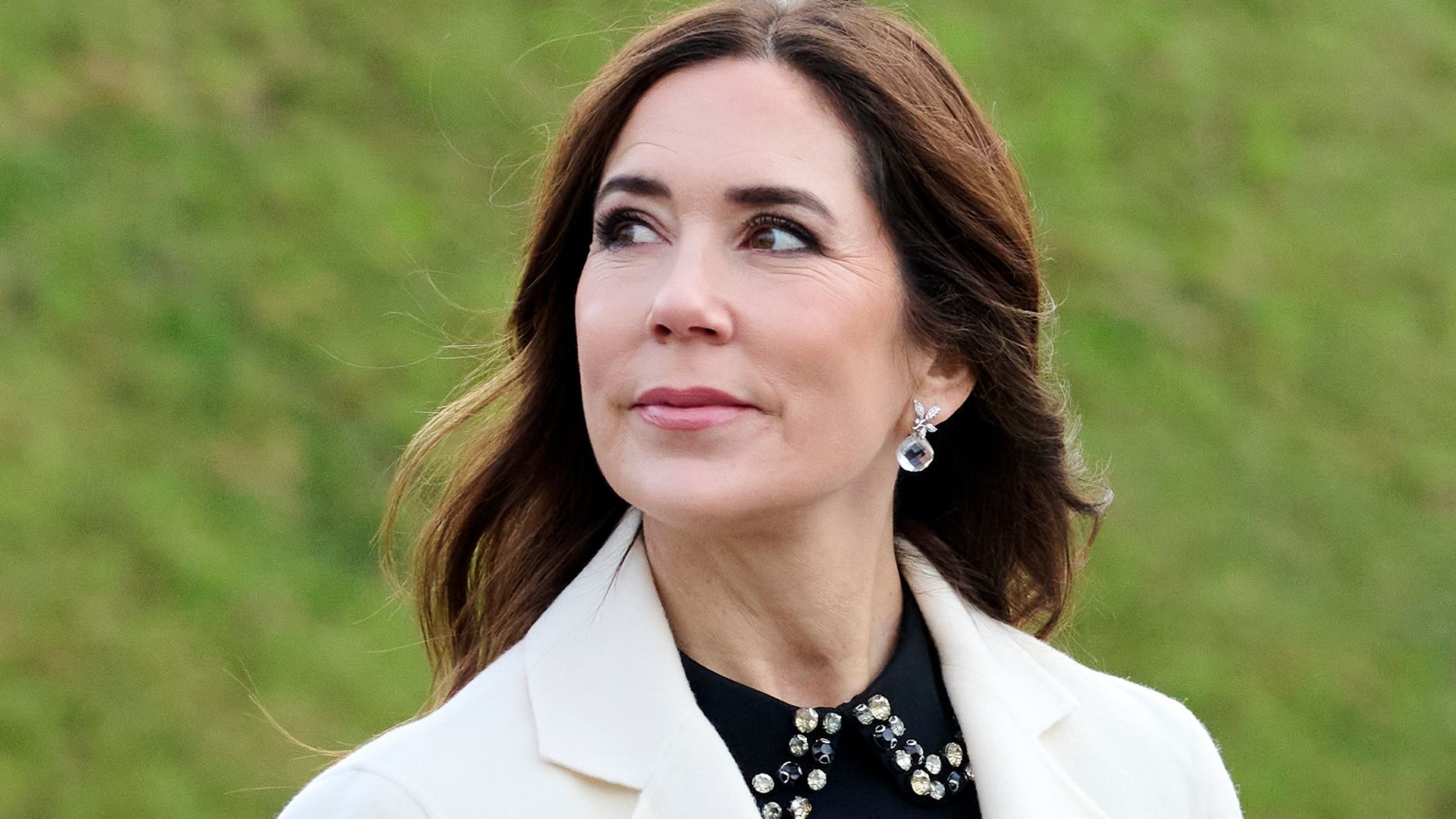 Crown Princess Mary wearing white coat with black embellished blouse