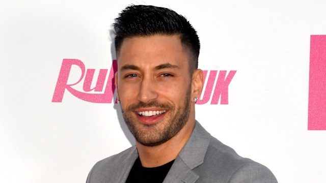 Giovanni Pernice in a grey jacket and black shirt