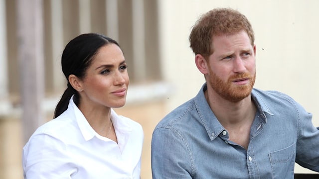 Prince Harry and Meghan Markle looking serious 