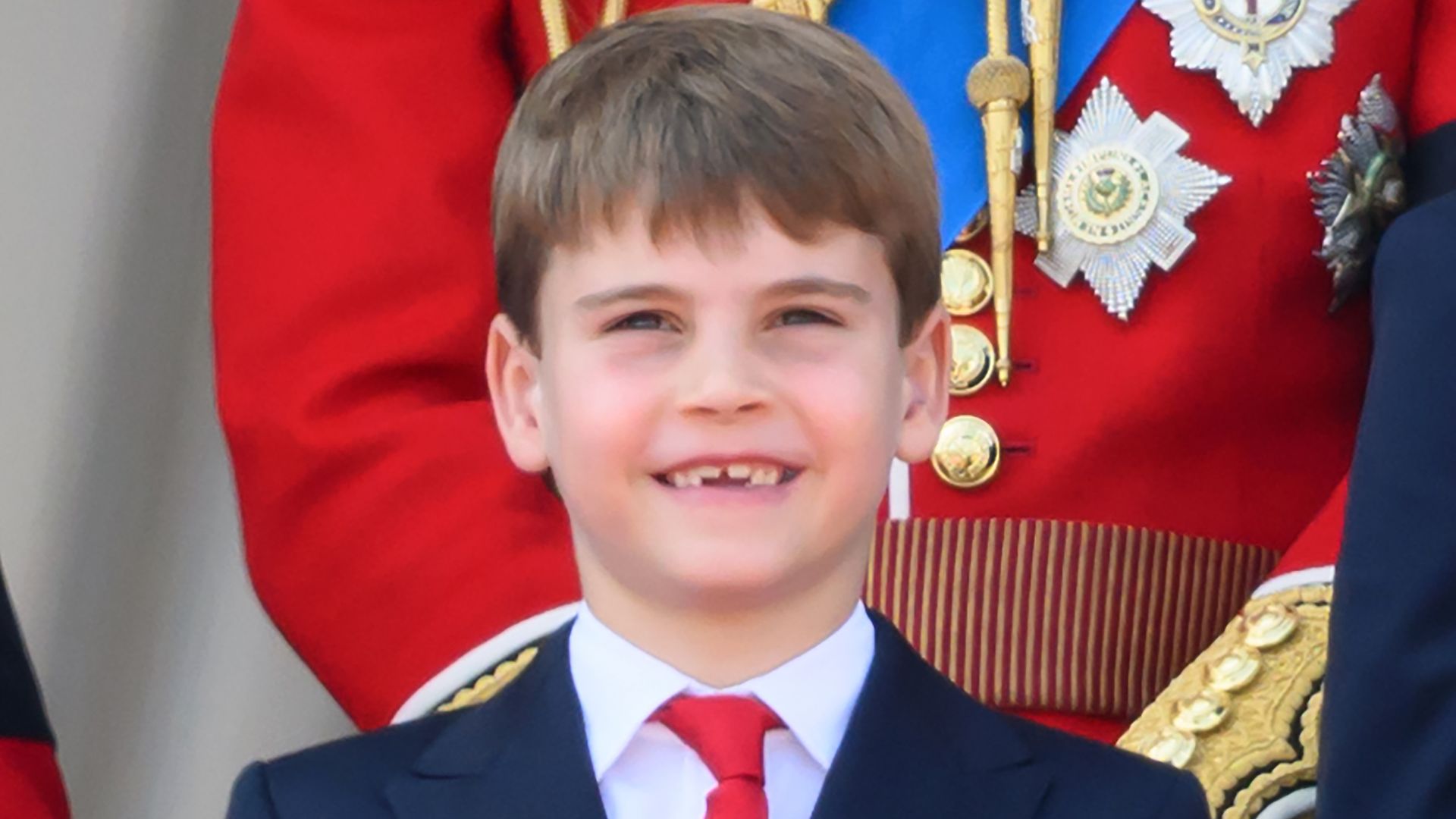 Prince Louis smiling in suit