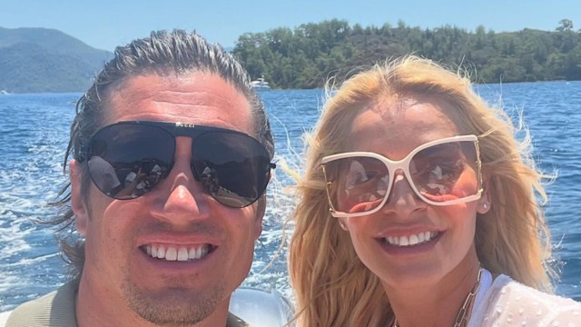 couple posing for boat selfie