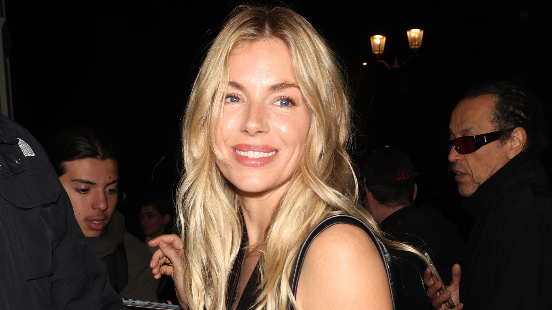 Sienna Miller stuns in leather crop top and low-slung jeans at Paris Fashion Week