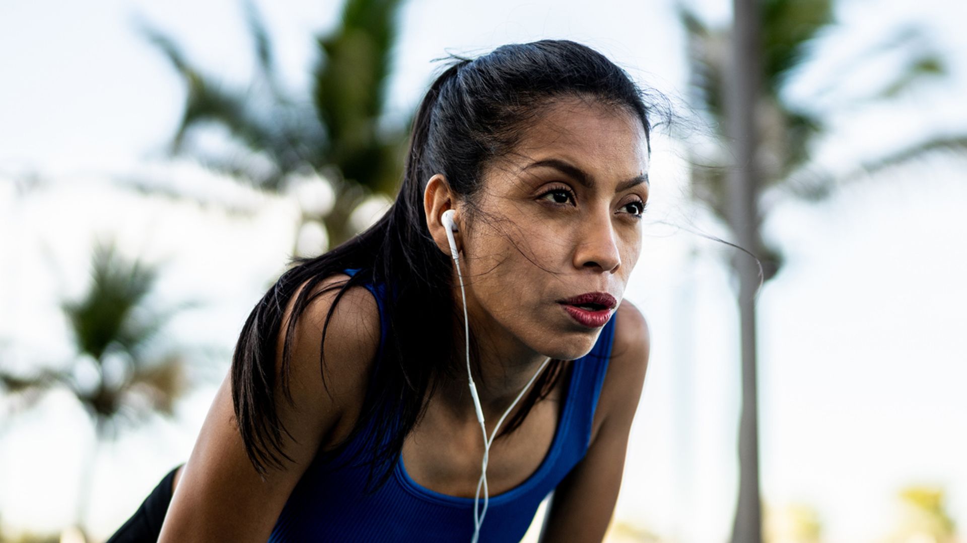 Young sporty woman tired after running outdoors