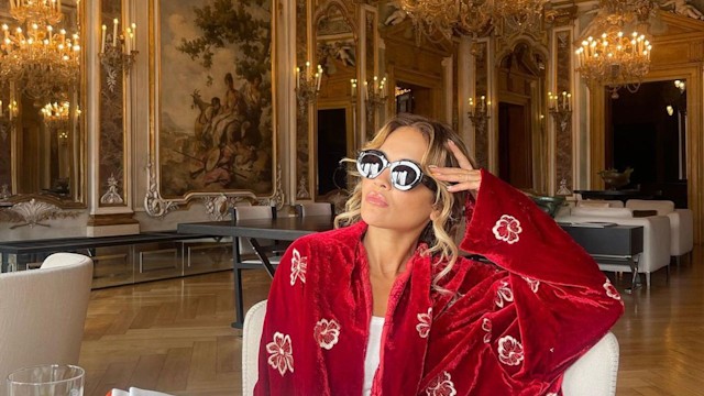 Rita Ora wearing a sumptuous red robe 