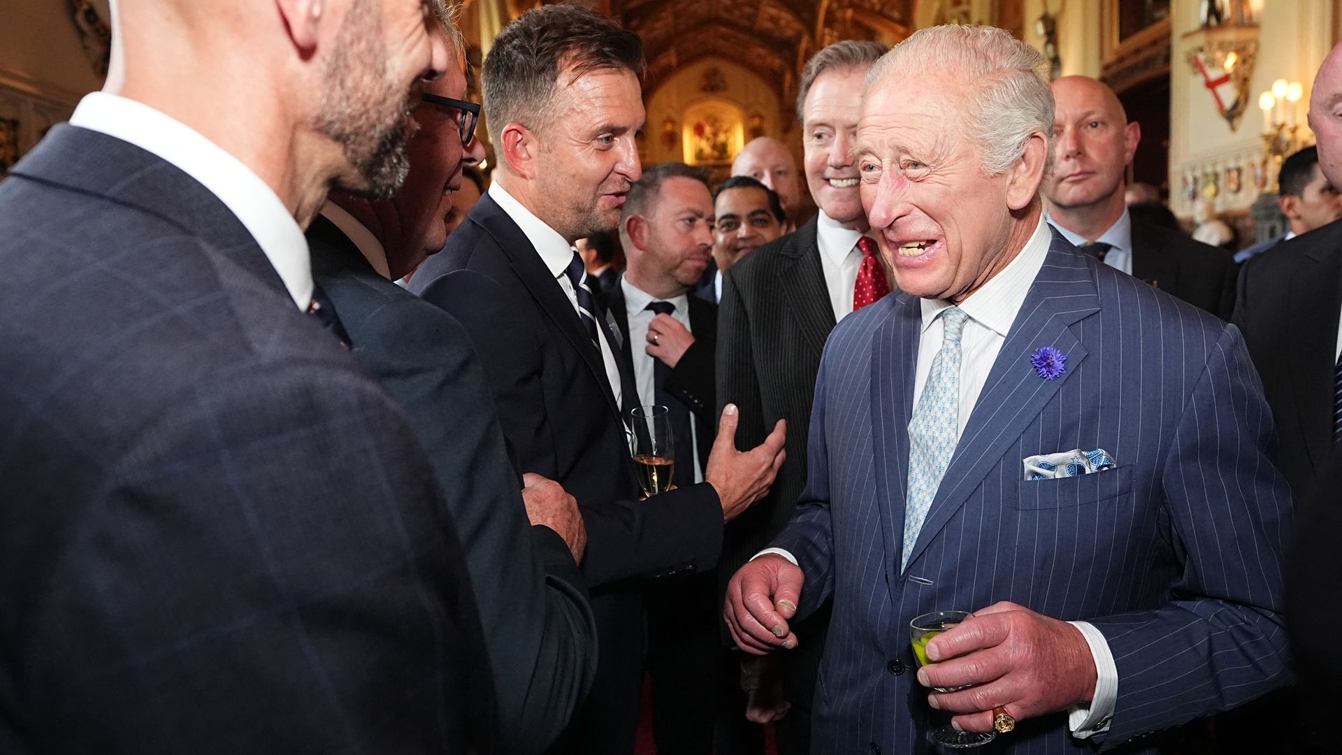 Britain's King Charles III speaks to guests during a reception for recipients of The King's Award for Enterprise