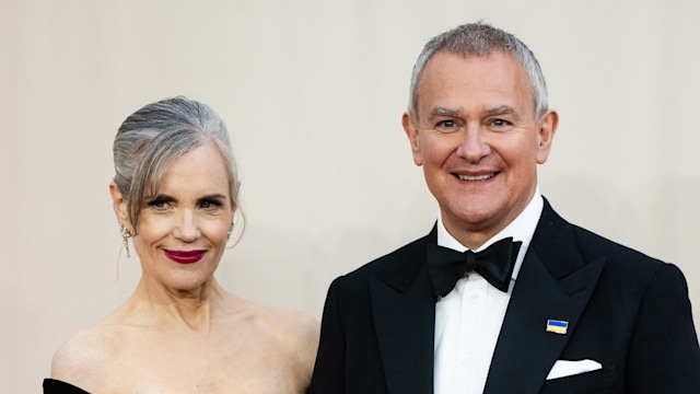 Elizabeth McGovern and Hugh Bonneville arm in arm