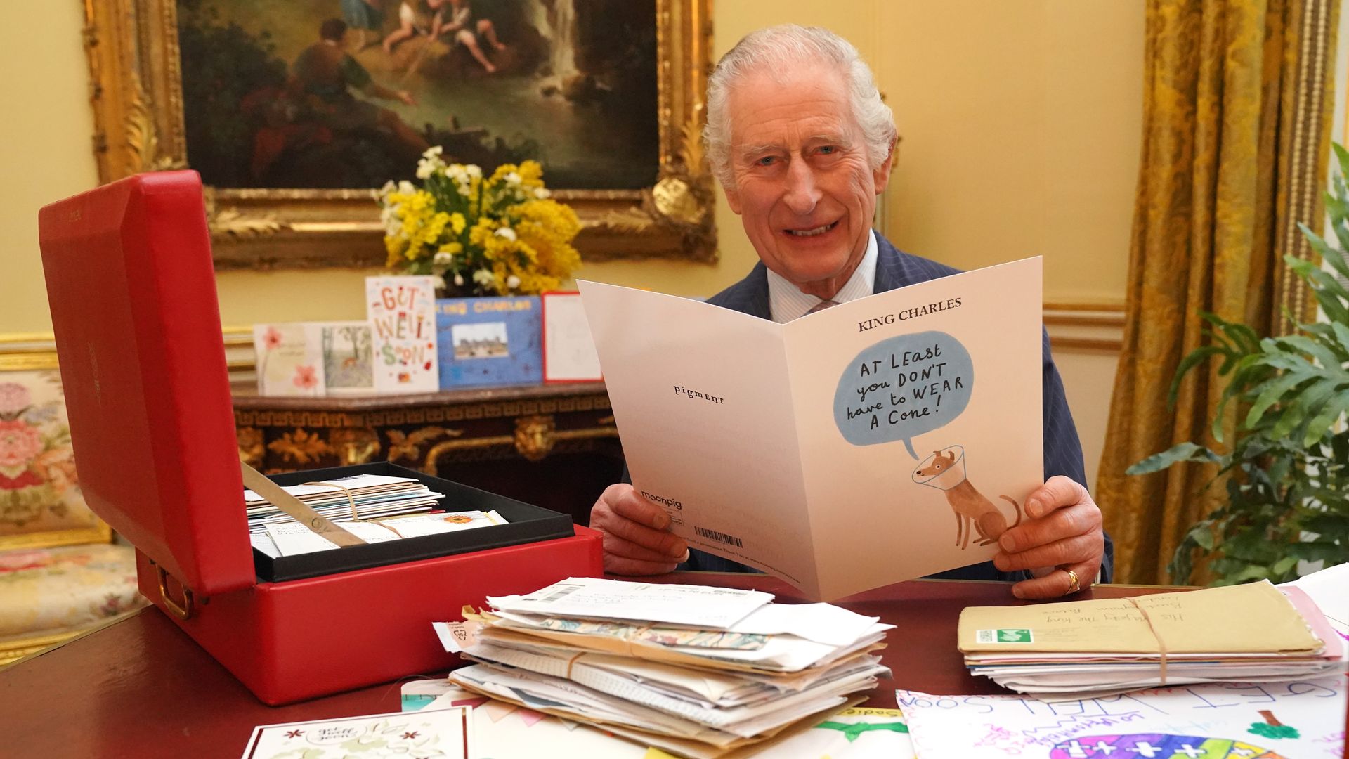 King Charles looks visibly touched as he's inundated with get well cards from the public
