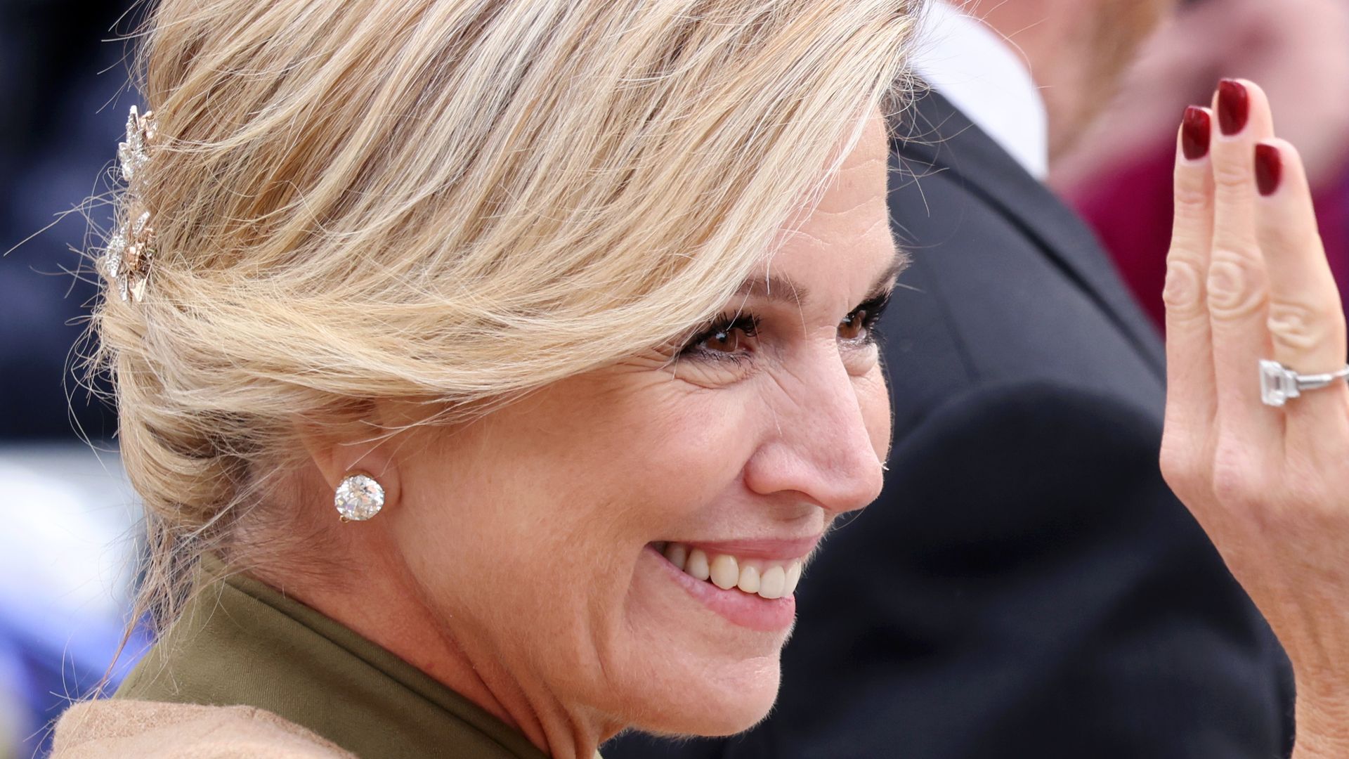 Queen Maxima of the Netherlands waving side on