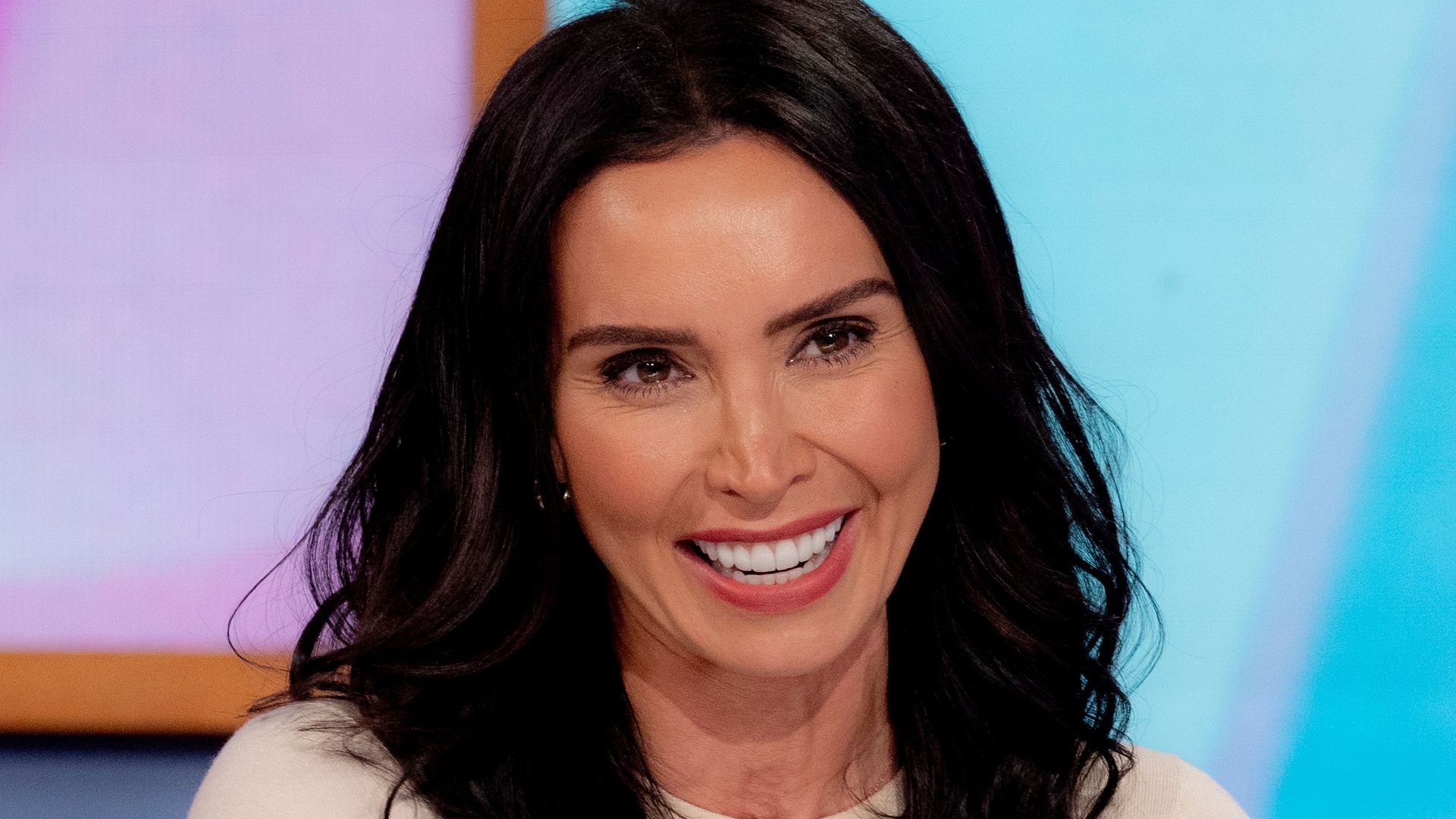 Christine Lampard on Loose Women wearing beige top and pink lipstick
