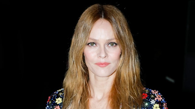 Vanessa Paradis in floral shirt and leather skirt