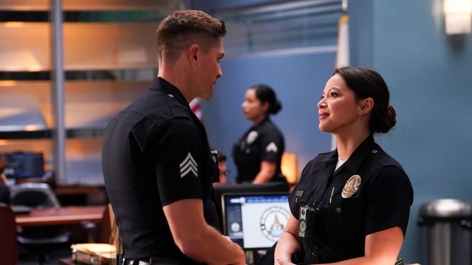 Tim Bradford and Lucy Chen speak in the police station in The Rookie