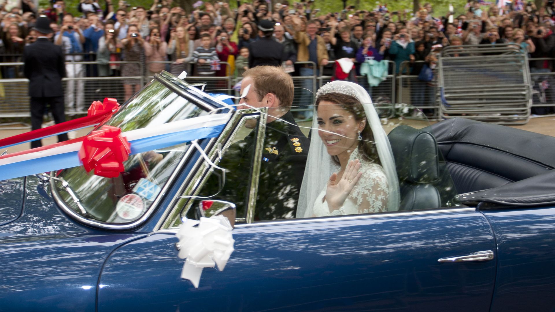 Prince William driving Kate Middleton down The Mall following their wedding