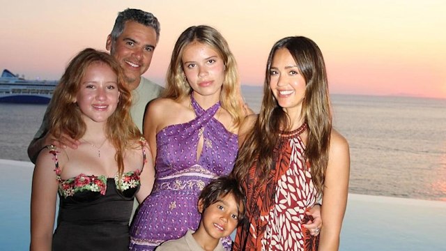 Jessica Alba (RIGHT) poses with her family in Mykonos in front of a sunset 