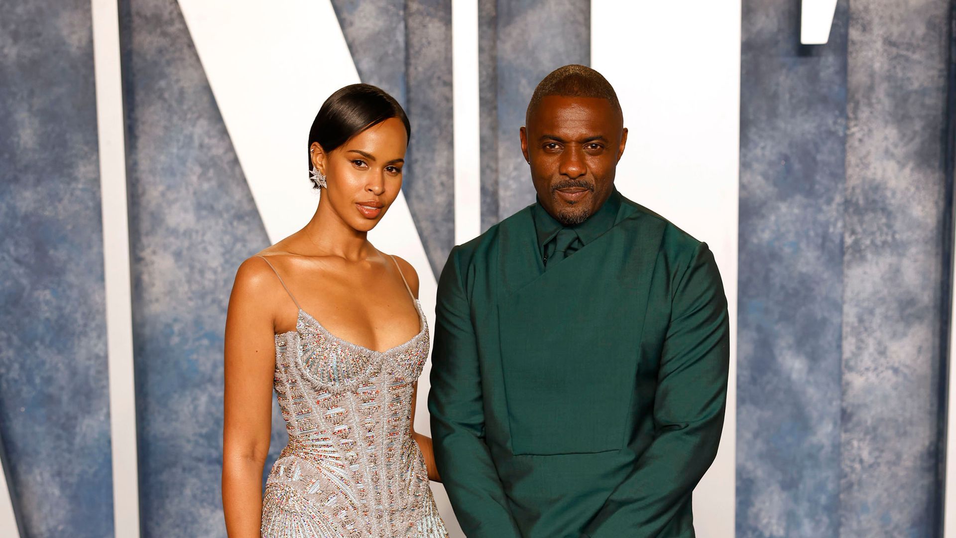 Idris Elba eclipsed by model wife Sabrina's appearance in very daring red dress
