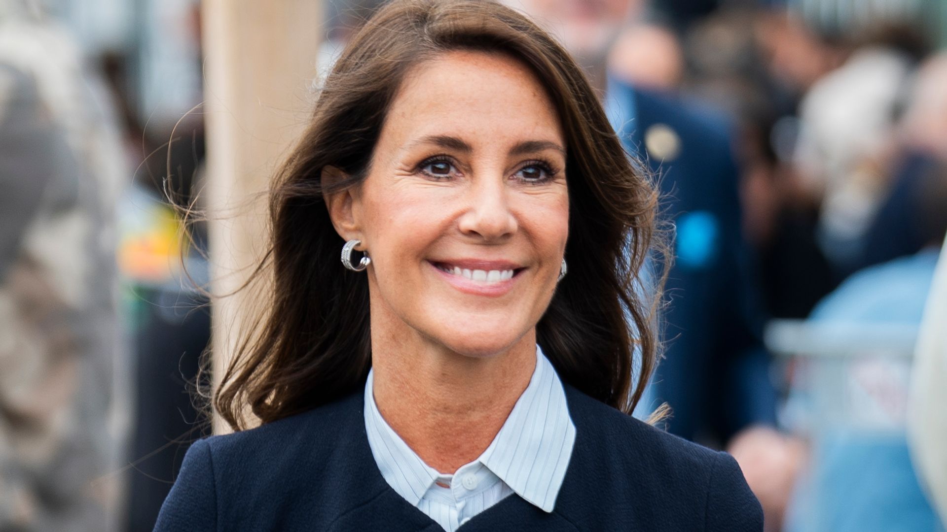 Princess Marie smiling in collared shirt and navy coat