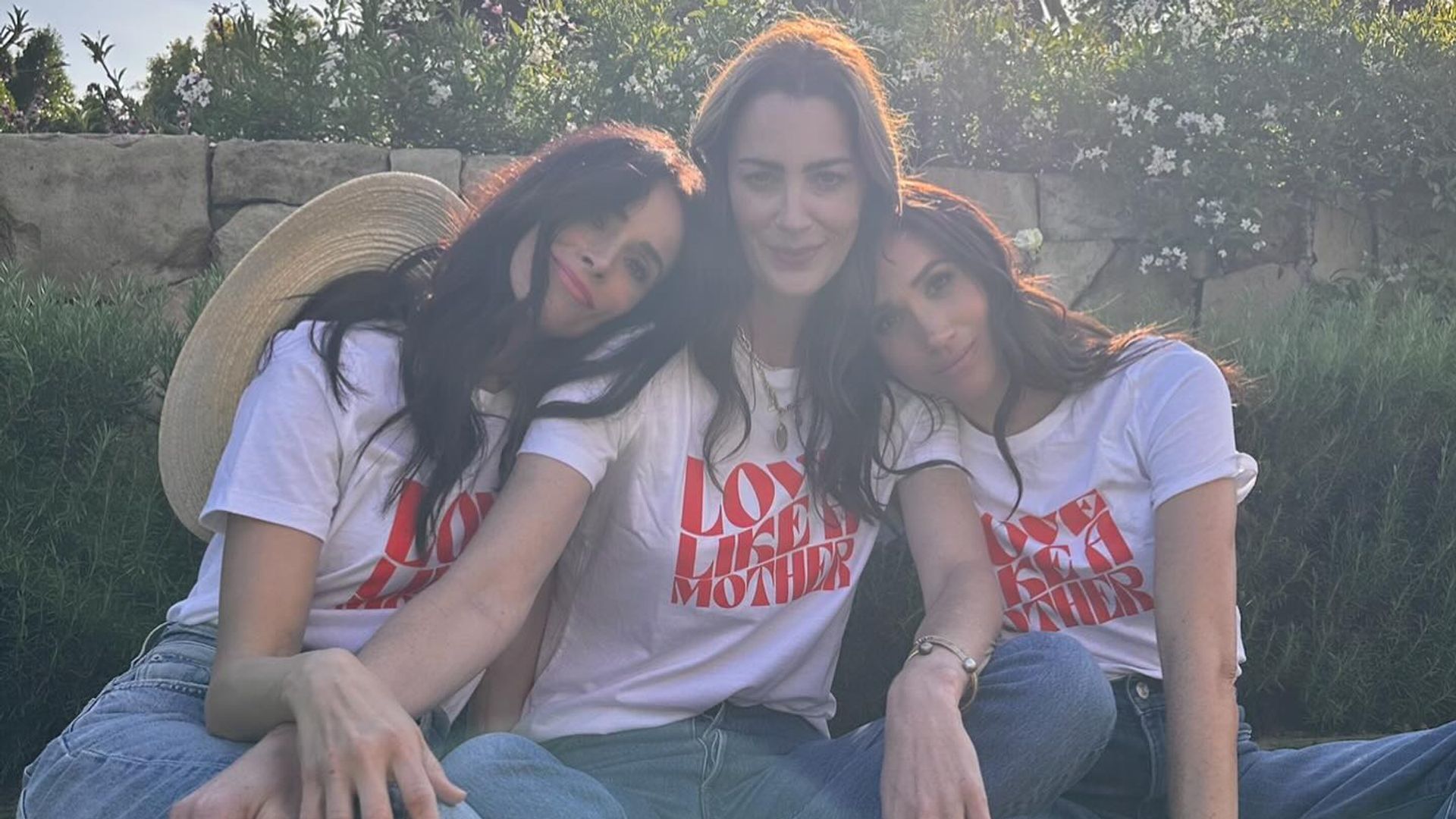 Abigail Spencer, Kelly McKee Zajfen and Meghan Markle wearing t-shirts and denim