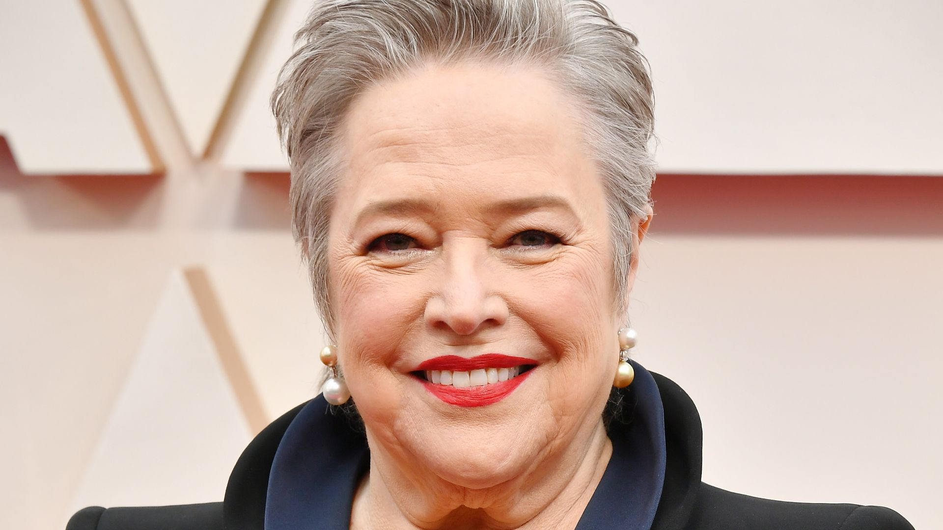 Kathy Bates smiling on the Oscars red carpet