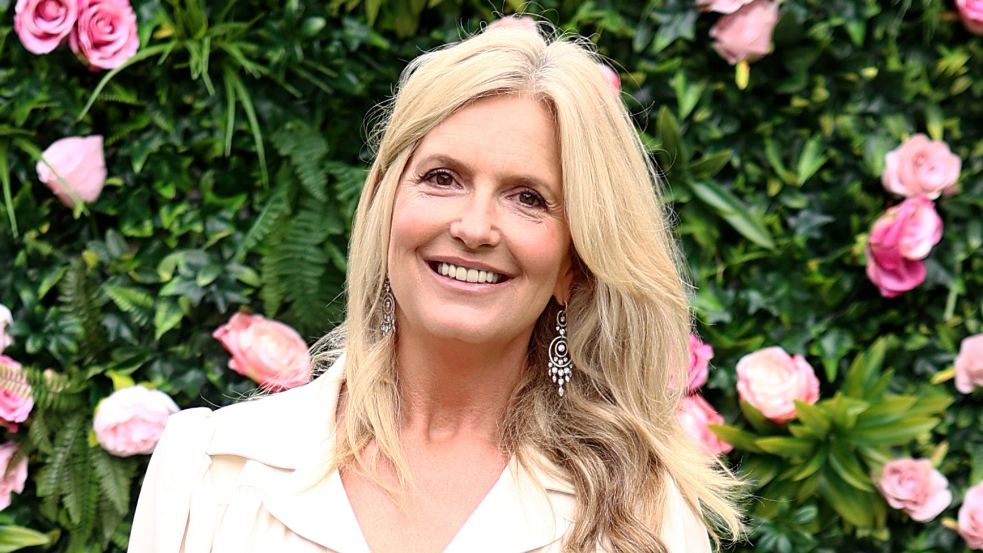 Penny Lancaster is a vision in flattering bridal white Vneck dress