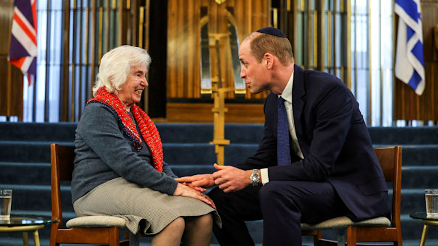 Prince William holds Renee Salt's hand