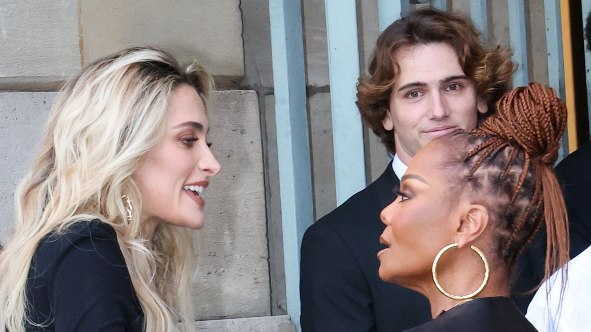 Paris Jackson in black dress and Janet Jackson in leather top speaking at Tom Ford Womenswear Spring/Summer 2026 show