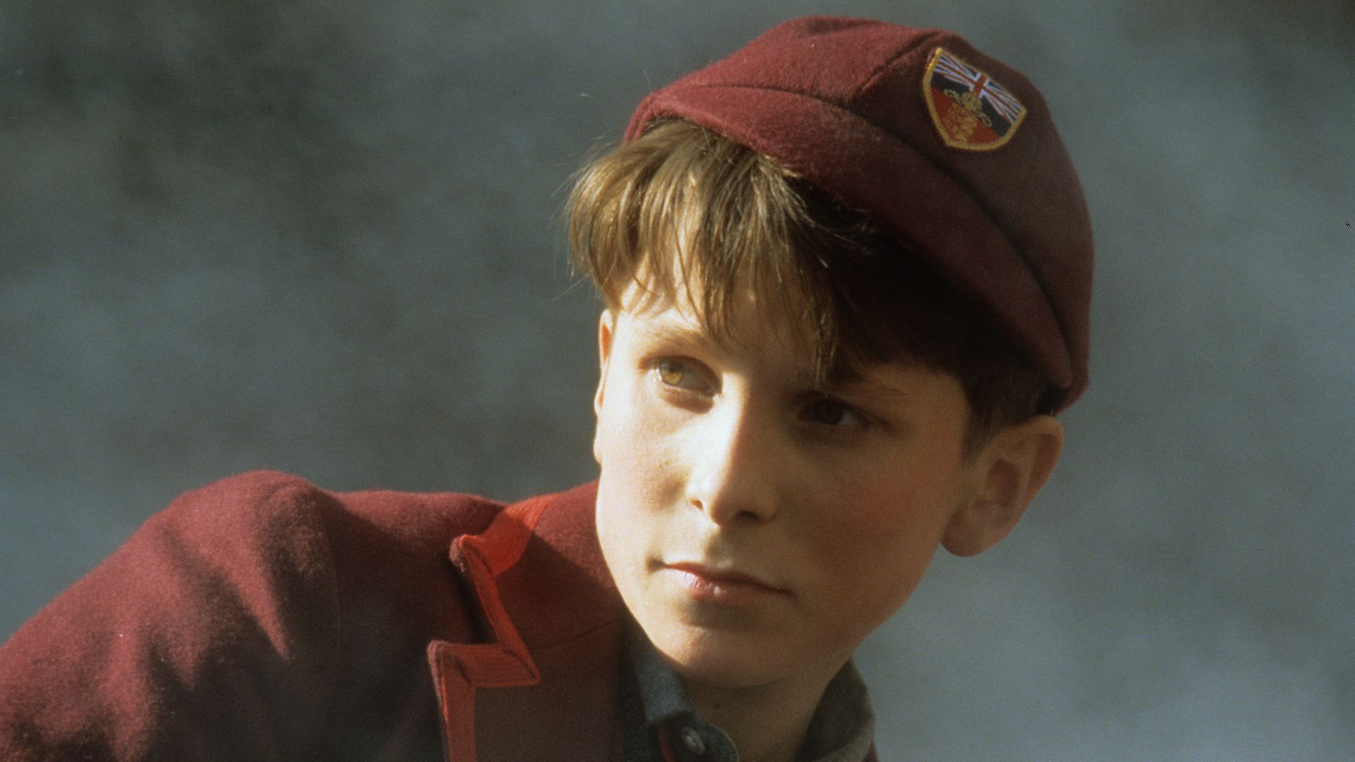 Christian Bale looking to his right in a scene from the film 'Empire Of The Sun', 1987