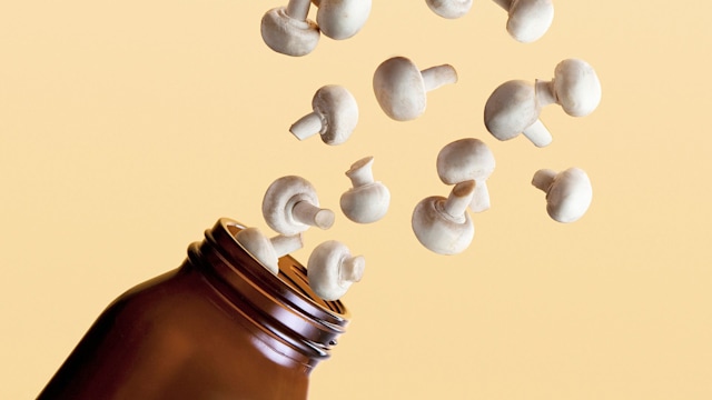 mushroom supplements spilling from a jar