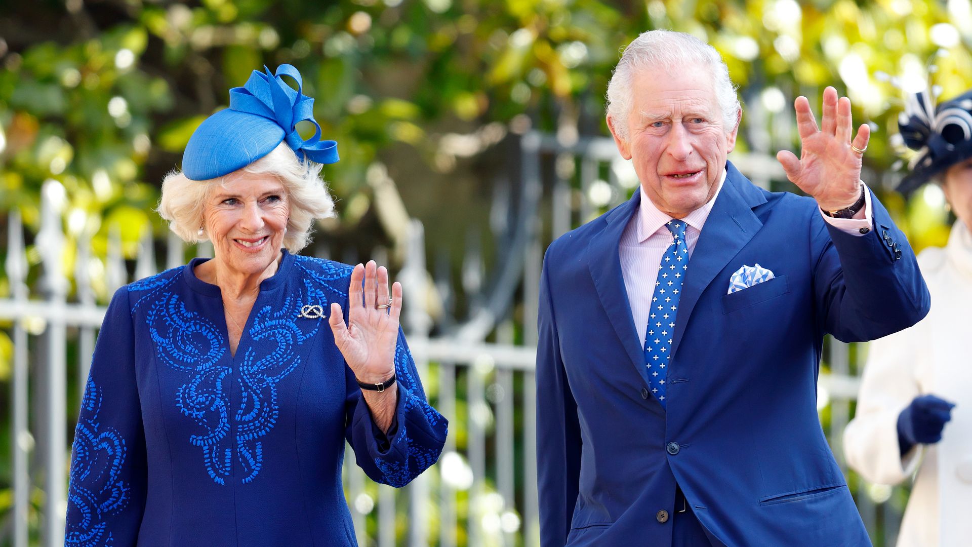 Queen Consort Camilla and King Charles wave on Easter