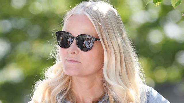 Crown Princess Mette-Marit in denim shirt and sunnies