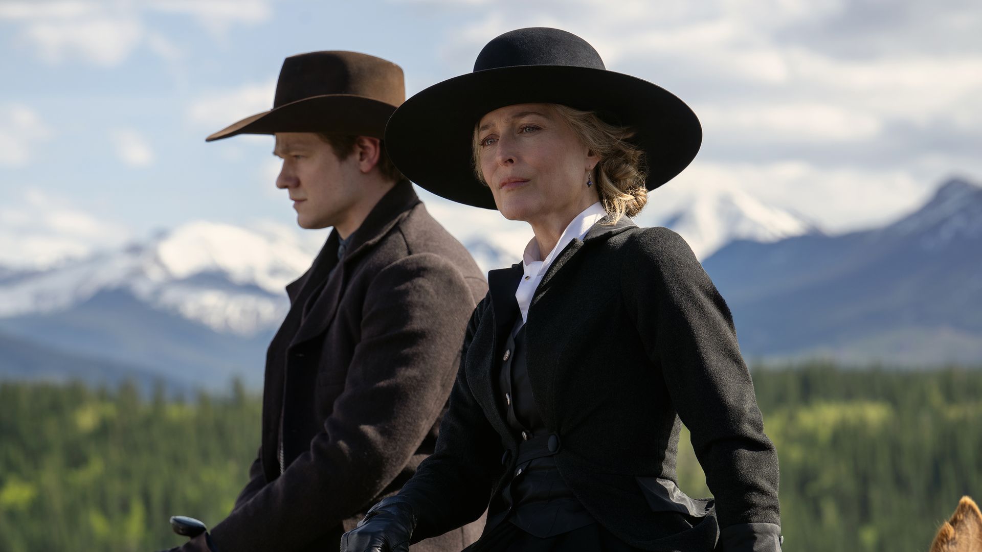 man and woman riding horses