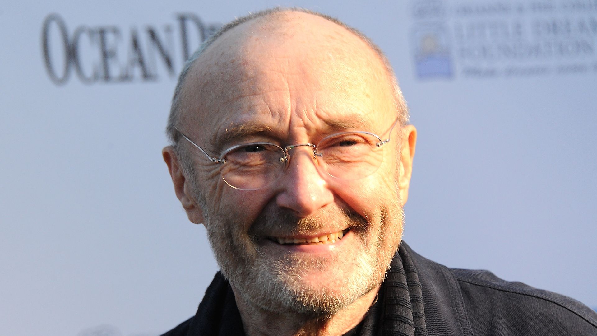 Singer and drummer Phil Collins smiling