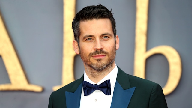 close-up of man in suit at red carpet premiere