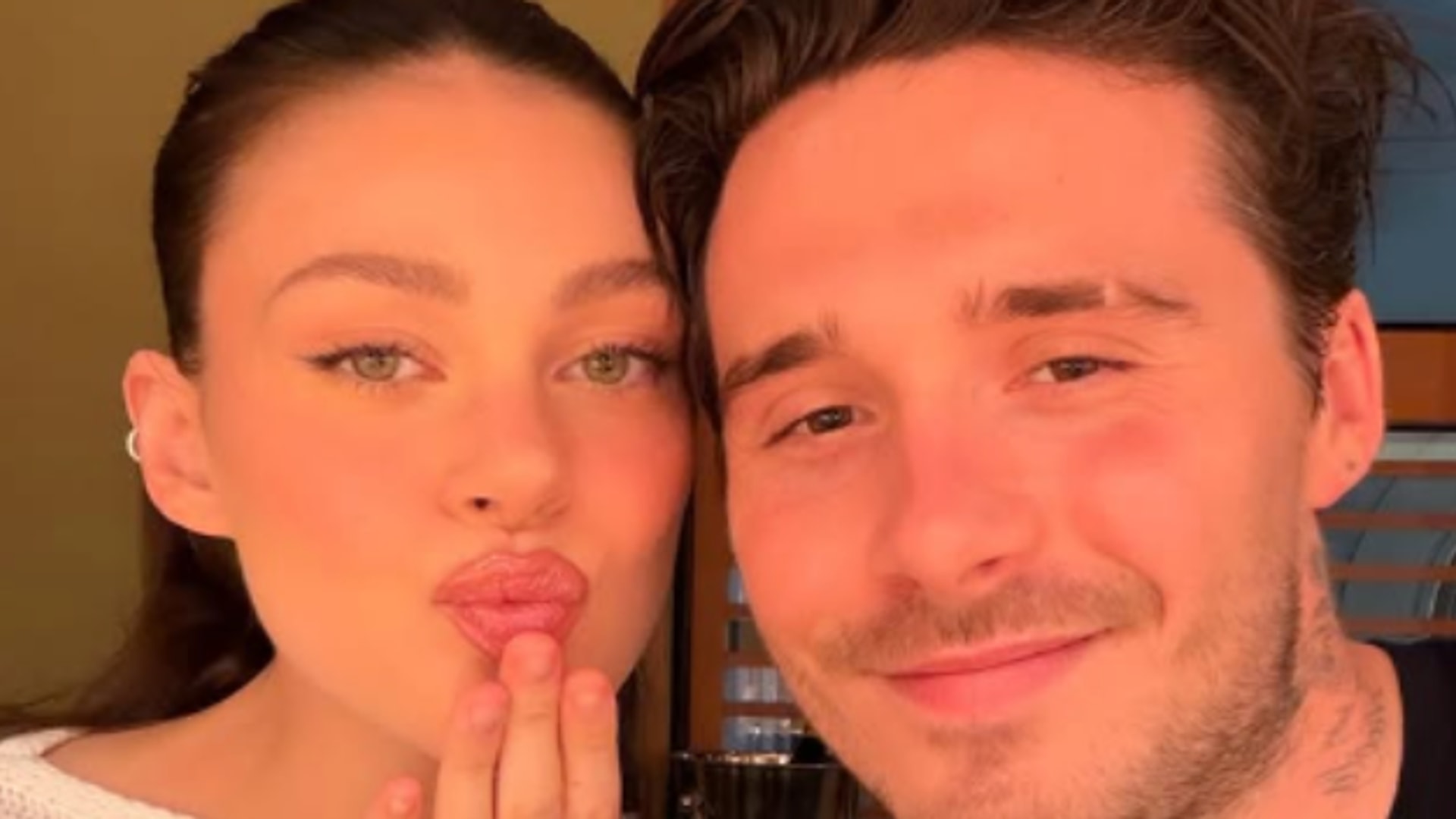 Brooklyn Beckham posts snap with Nicola Peltz after skipping Victoria Beckham's fashion show.