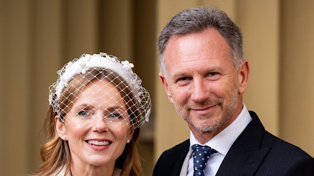 couple posing outside palace 