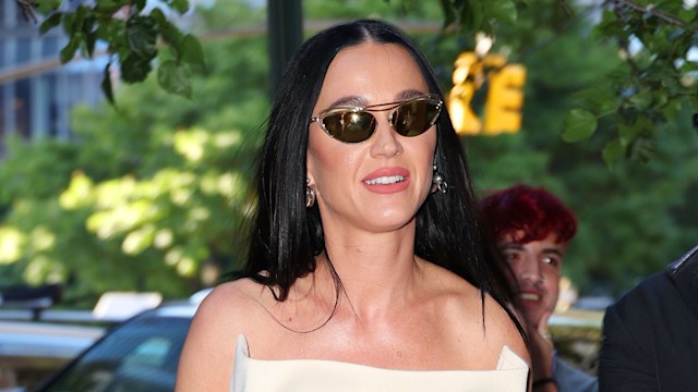 Katy Perry in dark shades and strapless dress