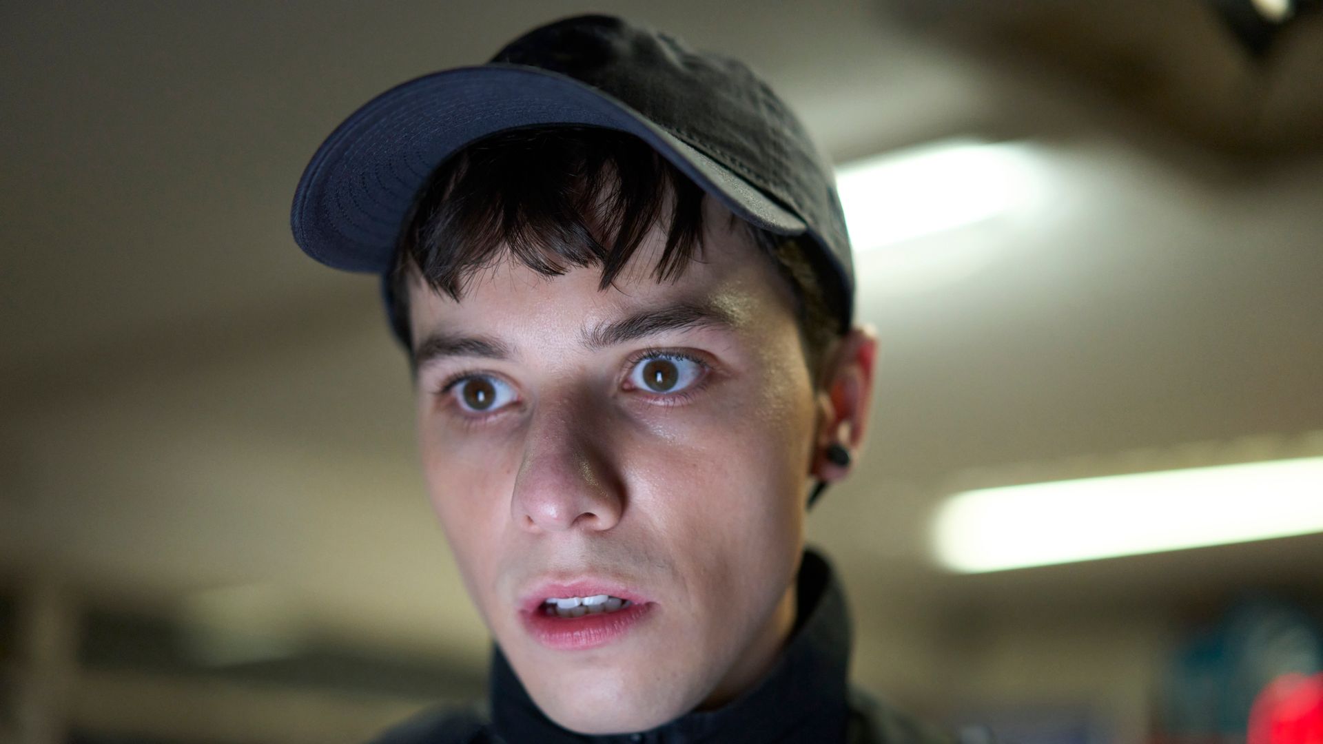 close-up of teenager wearing cap